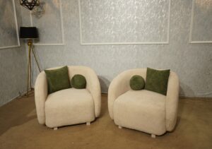 Pair of modern cream boucle barrel accent lounge chairs with olive cushions — My Furnitures Islamabad